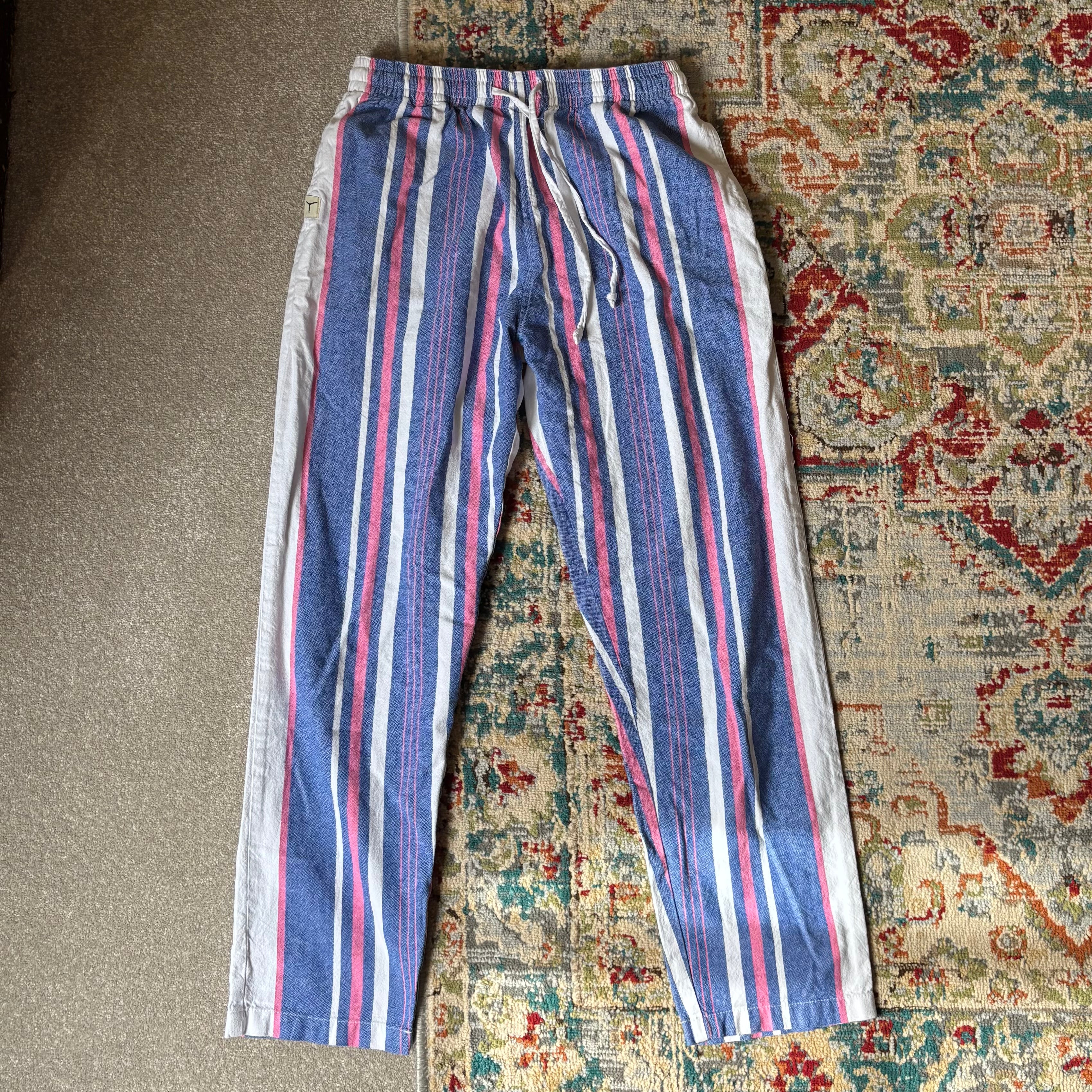 tom's trunks pink, white and blue trousers
