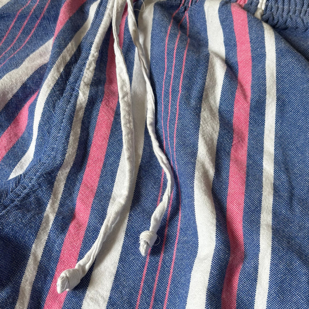 tom's trunks pink, white and blue trousers